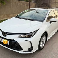 كورولا هايبرد 2025 خليجي رقم بغداد جديد باسمي مكفولة من الصبغ والتبديل...
