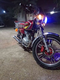 دراجة نارية • مكفول • باسمي