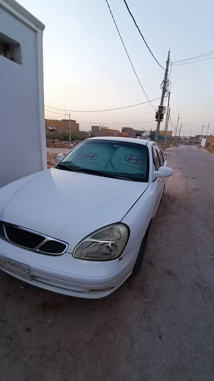 دايو نوبيرا موديل 2002
سيارة جاهزة كير مكينة حدادة تبريد 
زوج تايرات جدد بلوتوث سنتر لوك دسكات جدد
سيارة حيل ناعمة وبدون دوانز نهائيا لو اديرلها نفط هم تمشي 
مكينة جديدة بالجيس شادها بلكات جدد البارحة شادهن بخاخات ادامة عليهن فيتبم جديد فلاتر نافضها نفض 
شغل واطلع لمحافظتك وين ما جان رقم بغداد الماني سنويتها لنهاية 2027 سعرها 46 ومجالها حك جية فقط رجاءا الموشراي لا يواعد يرحم والديكم سيارة جاهزة واتعاتب عليها وبالعافية عالشراي وينة الفلوسة قليلة ويدور سيارة جاهزة وما اتعبة 
مكاني ديوانية ***********
