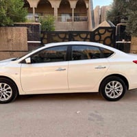 نيسان سنترا 2025 ماشية 6000 مكفولة بأسمي رقم بغداد فتحة تحكم شاشة كبير...