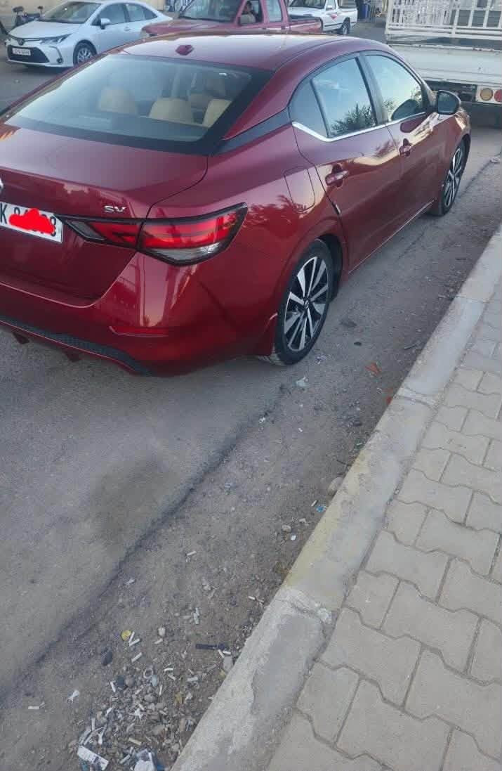 🚗 نيسان سنترا 2021 - SV (رقم اربيل  فول مواصفات)
اللون: ماروني
المحرك: 4 سلندر بسعة 2.0 لتر
كير: أوتوماتيك CVT
​فتحة سقف
​ تشغيل عن بعد + بصمة أبواب (دخول ذكي).
​رادار أمامي / مانع اصطدام مع فرملة طوارئ تلقائية.
 كشف النقطة العمياء 
​ تحديد وتنبيه الخروج عن المسار.
​رادار خلفي / فرملة طوارئ عند الرجوع للخلف.
​تثبيت سرعة ذكي  (Adaptive Cruise Control).
​شاشة لمس كبيرة تدعم Apple CarPlay و Android Auto.
​كاميرا خلفية دوارة
​تكييف مع تحكم مستقل السايق والراكب
​كوشن جلد كهربائي  تدفئة للمقاعد 
​ تحكمات ستيرن
​ويل كب ألمنيوم حجم 17./***********/بس شراي يدخل بله زحمه خوان رقمي بي واتساب
