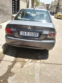 لانسر موديل 2009بسمي رقم بصرة بسمي ضرر جاماق و بنيد وداير الجاملقات ال...