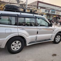 بايجيرو 2003محرك 3000مصبوغه حزام جماليه مكفوله من الضربه والتبديل محرك...