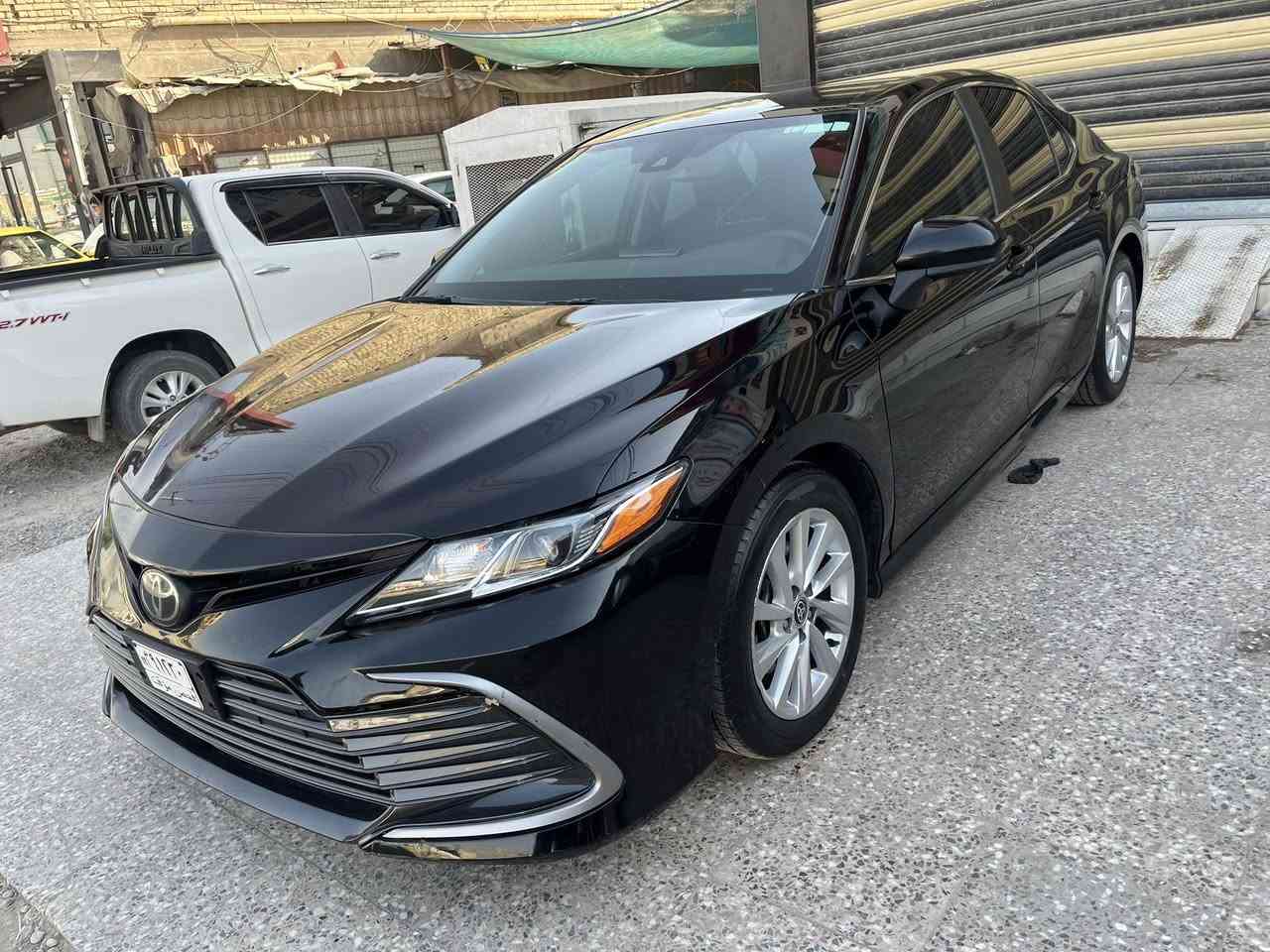 تويوتا كامري موديل 2023 وارد امريكي مرقم بغداد بأسمي ماشيه 43 الف ميل مواصفات LE بانزين حادث تقرير مياه امطار شرط برغي ما مفتوح بيه مكفوله ما عدى طلع بيه جاملغ وبنيد كلير فقط بدون صبغ بدون معجون من امريكا السعر 170 ورقه للاتصال *********** مكاني بغداد
