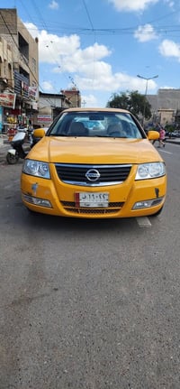 نيسان سني 2009 خليجي تكسي اصل ابيض لسعر 75$ مكان بغداد التاجيات 077359...