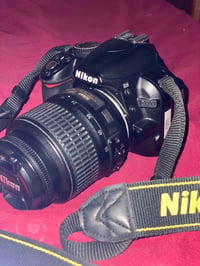 نيكون D3100 • شاحن وبطارية • شاتر ١١٠٠٠