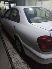 نيسان سني ياباني 2006جاهزه كل نقص مابيه بيه باب الخلف السائق صبغ سعرهه...