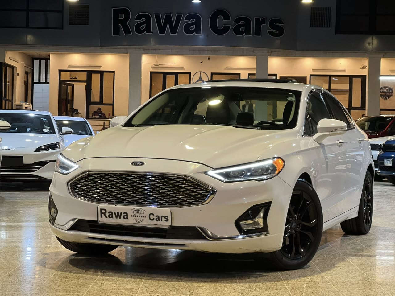 ‎عربى/کوردی
فورد فيوزن, SEL 2019
عدد الأميال : 102,000 ميل
ضرر: بدون صبخ
 سلندر : 4 سلندر
‎محرک :  توربو 1.5

الكاميرا الخلفية - مستشعر وقوف - بصمة - مسند الذراع - مثبت السرعة - شاشة - مراقبة النقطة العمياء - نظام المفتاح الذكي - مقاعد كهربائية - 8 وسادة هوائية - مصابيح زينون الأمامية - المصابيح الأمامية ليد  - شاحن لاسلكي

*** *** *** *** *** *** *** ***
فورد فيوزن, SEL 2019 
ماوەی ڕۆیشتن : 102,000 ميل
بۆیاغ: بی بۆياغ
پستۆن : 4 پستۆن
‎بزوێنەر : توربو 1.5

کامێرای دواوە  - حەساس - بەسمە - ڕاگری مەچەک - دیاریکرنی خێرایی - شاشە - ئاوێنەی ڕادار - سیستەمی کلیلی زیرەک - کورسی کارەبایی - 8 پەرەشووت - لایتی پێشەوەی زینۆن - لایتی پێشەوەی لید - بارگاویکەرەوەی بێتەل

📲

Whatsapp
Korek

0750 489 8729
0750 311 9925
0775 888 5388
