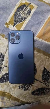 ايفون 12 برو ماكس لون نيلي ذاكرة 128 بطارية 77 مبدل شاشة والجامة مالكا...