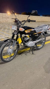 سوزوكي • AX100 • ٢٠٢٦