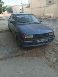مازدا ٣٢٣ • سامراء • مجال