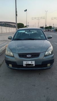 كيا ريو موديل 2006 وارد أمريكي  رقم بغداد إنكليزي بسمي مكينة 1600 مكين...