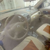 نيسان صني موديل 2004 السيارة(خصوصي) بسمي مشروع وطني اصفر غير محدد بلسن...