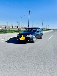 اوبترا  (فورنزا) موديل 2006 رقم بغداد الدولي سياره بيه  صبغ بنيد  وبيه...