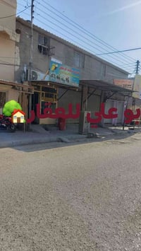 حي الانصار • شارع ١٥م تجاري • شقة و٥ محلات