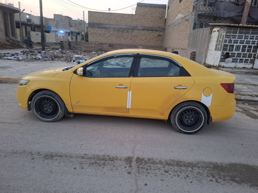 كيا فورتي وارد أمريكي مكينه ٢٠٠٠كير اوتو موديل 2010بيه جاملغ وبنيد جهت العبري مصفره هيئه وغرامات رقم نجف نكليزي بأسمي سنويه لل٢٠٢٧ السعر ٨٢ بيه مجال بسيط جاهزه حداديه تخم تاير كير غرفه جديده شاشه تابلت كهربائيات كله شغاله مصفره هيئه وغرامات  رقمي *********** مكاني ذي قار الشطره بيع او مراوس بخصوص الرفاعي, ذي قار
