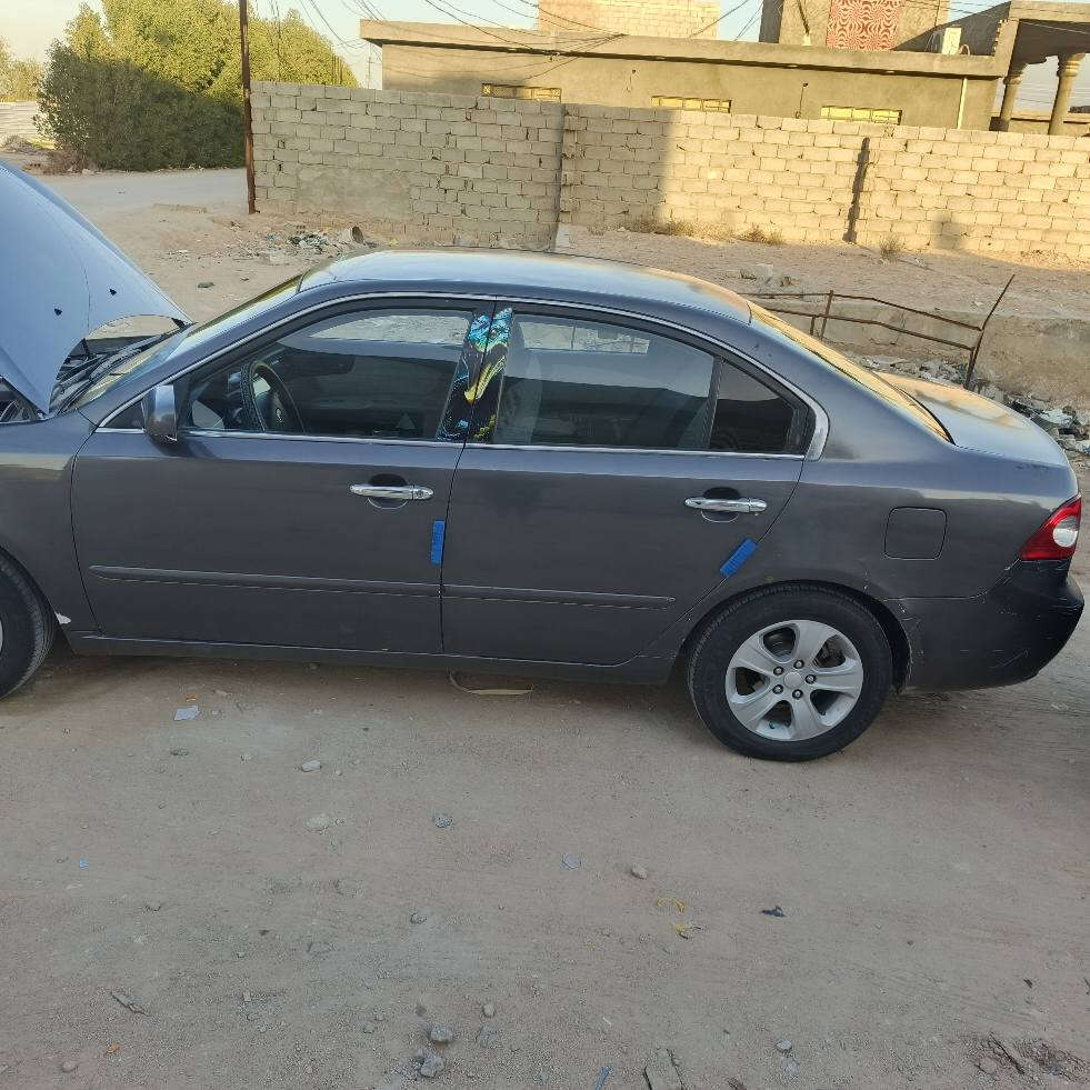 ‏سلام عليكم 
‏كيا اوبتيما /Kia Optima 🚗
‏مديل 2007 وارد امريكي سياره مصبوغه حزام 
‏ضررهاا جاملغ الخلفي بشرط لا حوضل ولا تكمله ولجاملغ الخلفي الثاني بيه بارد موضع بل صور فقطط بجم كبس ما ملعوب بيه  القماره بيها طلقات ثنين بس وجه القماره فقط 
‏السياره كلها ليبل واحد مابيها ولا  قطعه تبديل 
‏مكينه كير حداديه تخم تاير كله عشرط ومكفول مكينه لا تنقيص ولا بخار ولا دوانز 
‏ تبريد ثلج منضومه جديده 
‏كهربائيات كله شغال
‏  ABS1
‏2 تحكم ستيرين جهتين شغال
‏3شاشه تاب تدعم نضام اندرويد اوتو +ابل كار بلي 
‏4شاشه +كامره 
‏5دوشمه جديده غرفه السياره اتخبل 
‏6مثبت سرعه 
‏السياره حلوه ما متعوبه 
‏بسمي سنويه لل٢٠٢٨  رقم بغداد  بسمي شخصياا
‏سعرهاا  ٩٠ وبيها مجال لشراي يشلع عيوني 
‏مكانها نجف طريق كربله نجف عامود ٣٦٦
‏رقمي ***********/***********
‏واني خادم النجف, العراق
