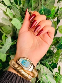 ساعة سيربنتي • تصميم أفعى • ذهب وألوان