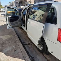 دوج كرفان ابيض رقم بغداد باسمي موديل 2014 حادثها باب الخلفي مع الجاملغ...