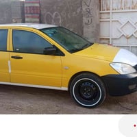 لانسر بغداد 10 بسمي السعر 70  سيارة بدون اي ضربة بس صبغ  الجمالية فقط ...