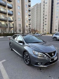 Nissan sentra 2019 SR  شاشە گەورە بەصمە سنوق و سەغال کوشن جلد و هیتەر ...