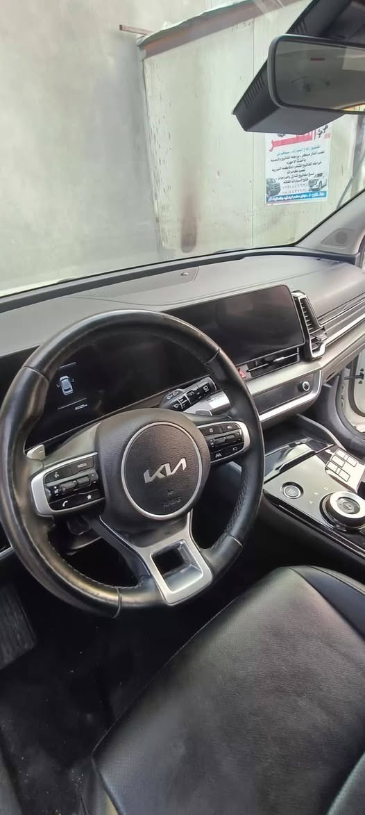#سبورتج  هايبرد|KIA Sportage
 - موديل 2023  
مرقم بغداد شبه مميز 57155
  مواصفات 
فور ويل  4x4
 محرك 1.6 لتر توربو هايبرد بقوه240 حصان (اقوى من جميع اصدارات سبورج واكثرهن اقتصاديه وعمليه)
 ‏تمشي بتفويله وحده 950km
 ‏#العداد 45 الف mi 
 ‏#حادث_السيارة بنيد وجاملغ
صبغ بنيد بدون اي تبديل 
ليبل واحد
 ‏#اللوحات بغداد شبه مميزة
 ‏#اللون ابيض
كير ماوس اوتيماتك 8 سرعات
تشغيل ذكي ( بصمة ) ,تشغيل عن بعد
شاشة Apple CarPlay, android auto 
تحكم ستيرين كامل مع تدفئه 
هاند بريك كهرباء
 شاشة كبيرة ( GPS )
 رادارات 360 
حساس خلفي
شاحن وايرليس
كرسي كهرباء 
تدفئة المقاعد الامامية
تدفئه مقود 
 هاند بريك كهرباء 
 مانع انزلاق 
 اوتو هولد ( AUTO HOLD )
 مساعد نزول المنحدرات 
 سستم صوت مميز
 ‏انظمه قيادة متعدده
 ‏نظام قيادة ذاتي
 ‏كشنات جلد فاخر طبيعي
 ‏منافذ USB +أواكس
185$ 
 ***********
