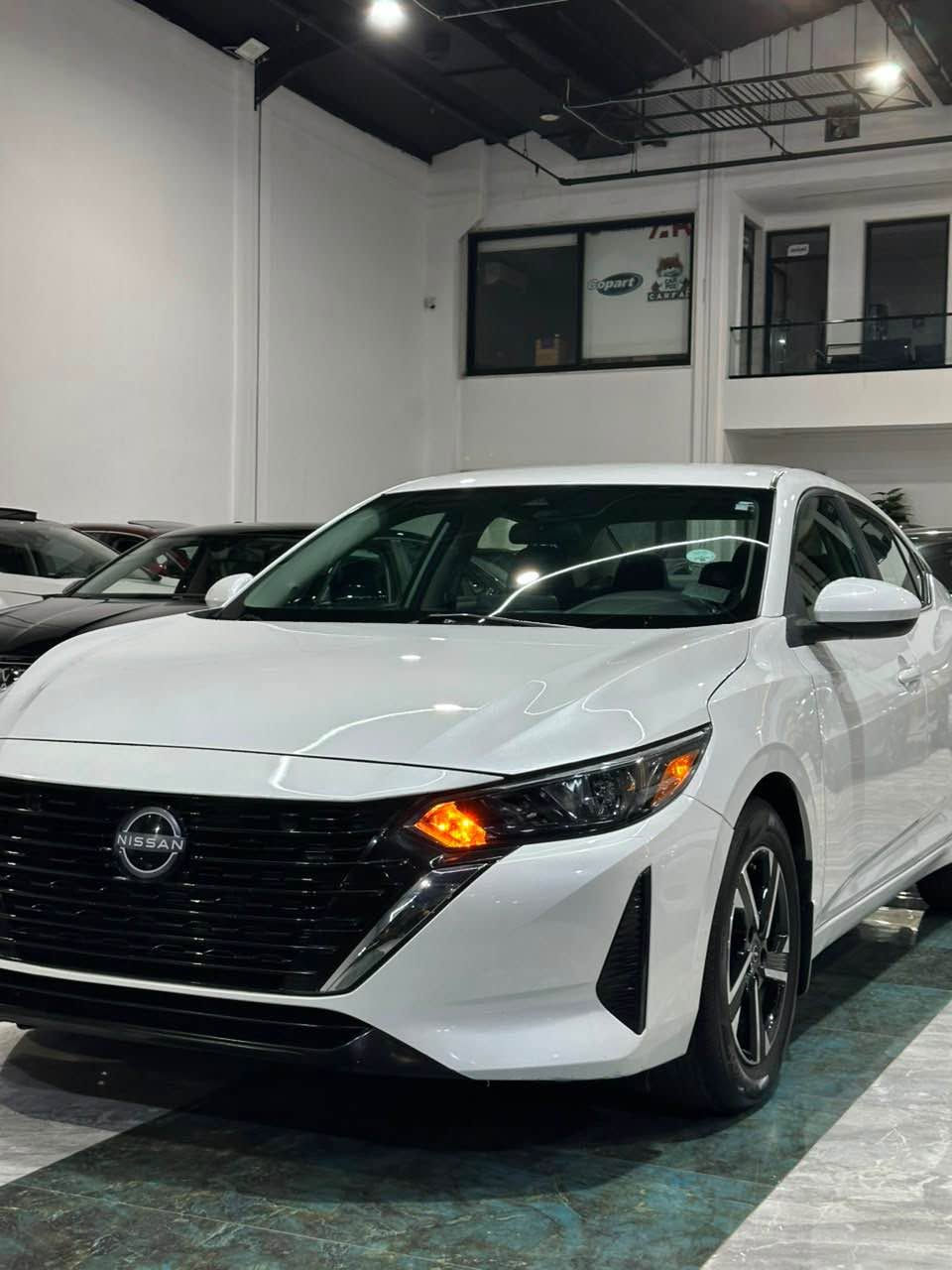 بسم الله الرحمن الرحيم 
NISSAN SENTRA SV
مۆدێل 2024
مواسەفات SV 
سەیارەکە بی سبوخە یەک جی بچووک pdr هەیە بیژۆری بەشەرتی بەهەموو شتەک 

سەیارەکە ئیرباگ ی شان و سوکانی تەقیە بەشەرت دانریتەوە دەشبوول بەشەرت 

ماوەی رۆیشتنی 16.000مایل 
                             
مەکینە و گیر بەشەرتە 

فوول مواسەفاتە ( کامیرەی دواوە ،  ،سندوقی کارەبای ،
راگری نشیوی ، حاساس ، کوشن گەرم ،  
بەسمە ، شاشە ، ئاوینە رادار ، 
6 ئیرباگ ، ئەپل کار پلەی )

سەیارەکە زۆر تەنک و ریک و پیکە  
سعر(١٤٥)مەجالکی کەمی تیدایە (***********) أربيل, العراق
