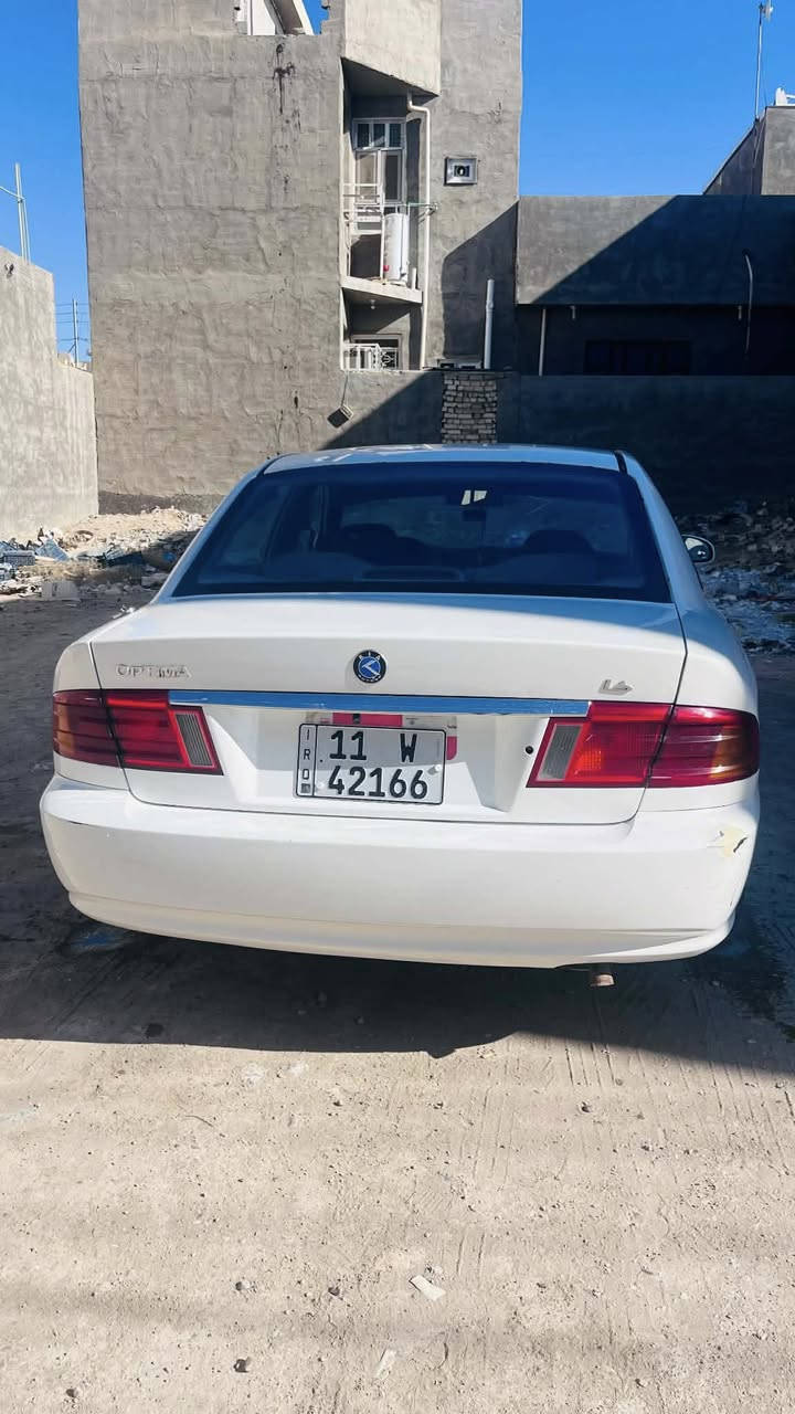 السلام عليكم 
اوبتما 2001 
كير مكينة لا تنقيص ولا تبخير
تبريد ثلج 
سنويه 29  باسمي رقم بغداد دولي 
تحويل ثاني يوم
مصبوغة عام للجمالية 
منضومه بريك جديده
راديتر جديده
باتري جديد
تخم تاير نضيف حيل 
بابل الاسكندرية 
***********
ب60 وبيها مجال
