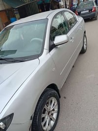 السلام وعليكم مازدا وارد امريكي ٢٠٠٧   لون سلفر    رقم بغداد   بغداد ا...