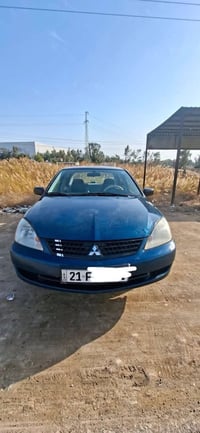 لانسر 2010   سياره جديده مكفوله عدا بارد بالجاملغ الخلفي ونص الدوسه صب...