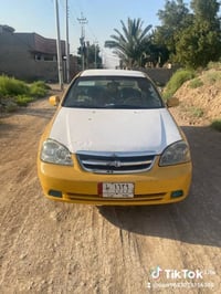 سيارة اوبترة موديل 2004رقم بغداد سيارة جاهزا كير عادي مكينة نضيفه تحوي...