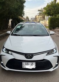 كورلا 2025  شكل الخليجي محرك 1800 هايبرد HEV  داخل جلد اسود رقم بغداد ...