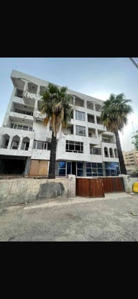 بنايه للبيع تجاريةتصلح فندق او مصرف مستشفى موقع كرادة بين ساحة الاندلس...