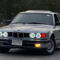 بي إم ٧٣٥i • رقم بغداد • جلد اسود