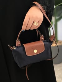 شنط لونج شامب • تصاميم كلاسيكية • أناقة فرنسية