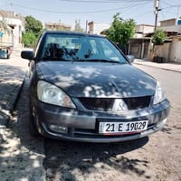 لانسر 2009 بۆ فرۆشن 07731150115