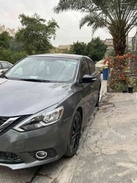 نيسان سنترا 2018  SR (MIDNIGHT) ماشيه ٩٥ الف كيلو متر رقم بغداد سنويه ...