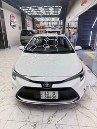 كورلا هايبرد • جلد احمر • ١٣٠٠٠ كم