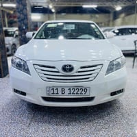 كامري ٢٠٠٧ علئ وضع الشركة لون أبيض السيارة بلاديه كفاله عامة رقم بغداد...