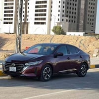 نيسان سنترا 2024 اللون ماروني (عنابي) بيع او مراوس   ماشية 12 الف   مو...