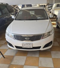 دليل العراق  السيارات  اوبتما ٢٠١٠ بيه داير جاملغ الخلفي وبيه شويه جوه...