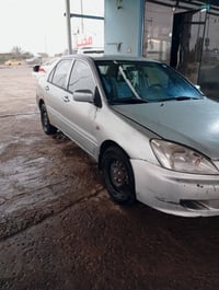 لانسر ٢٠٠٥ • نظافة ٨٠٪ • تحويل مباشر ٢٠٣٠