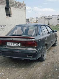 مستبوشي لانسر 1992 رقم نكليزي  كابون بيها وشرط تحويل  محرك بدايه رخاوه...