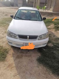 البيع نيسان سني ياباني 2002  محرك1800 قبق اسود كير عادي 07713577506