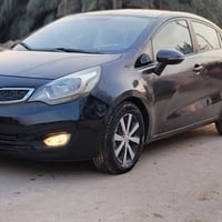 كيا ريو 2014 خليجي محرك 1600 قطرتين  العداد 135 الف رقم ميسان السعر 70...