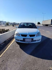 لانسر • محرك ١٥٠٠ • ابيض