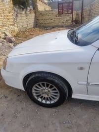 شوفر ليت ابيكا موديل ٢٠٠٦ رقم بغداد دولي بأسمي مكفولة من الضربه جاهزه ...