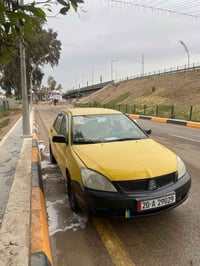 لانسر ٢٠١٠ • تكسي • رقم انكليزي