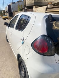 2013رقم بغداد بإسمي  گير مكفول ومحرك مكفول وتبريد مكفول  السيارة ماشية...