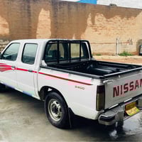 نيسان ٢٤٠٠ • ٢٠٠٤ • كويسينجاك